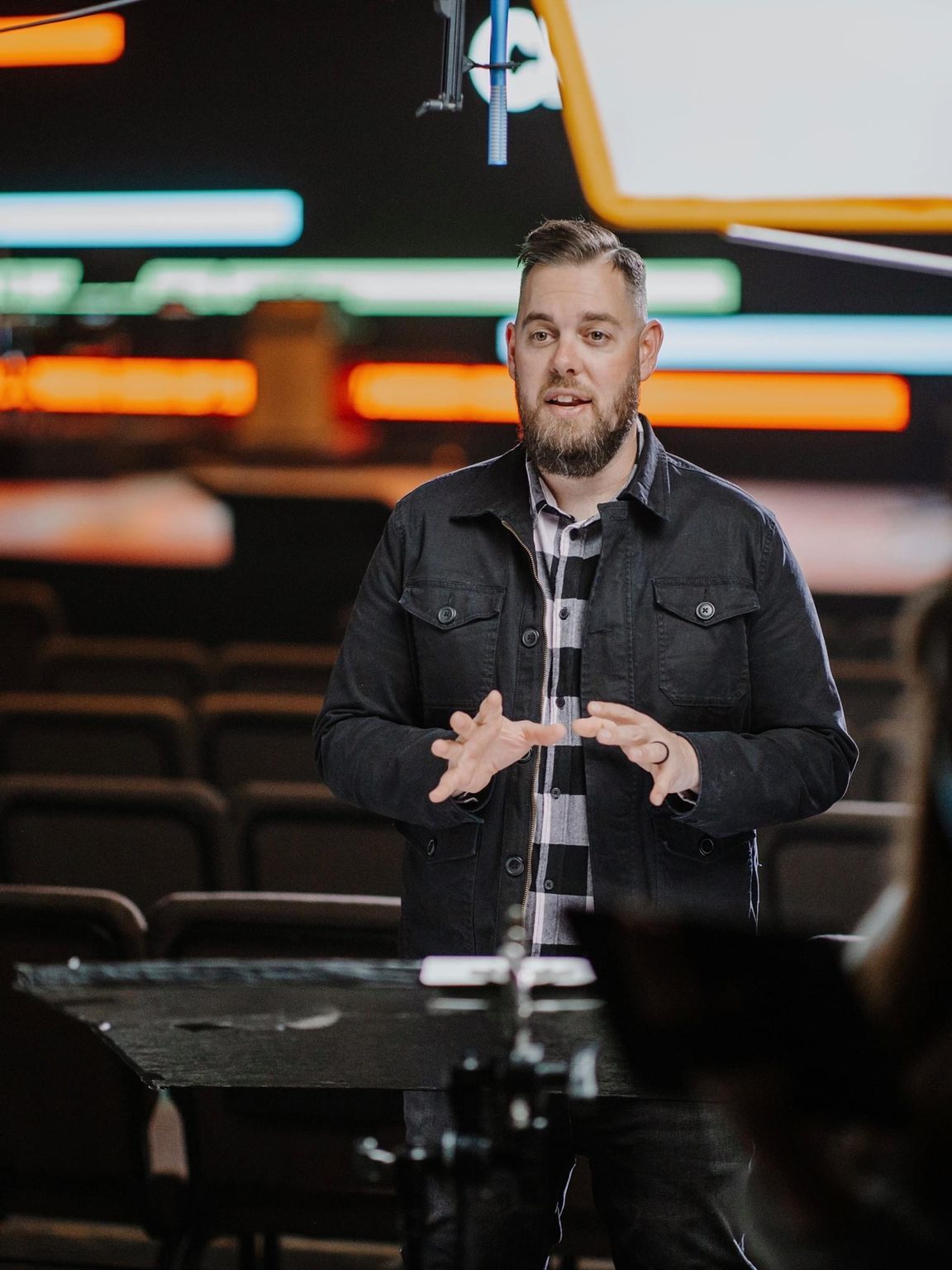 Drew Powell teaching in an auditorium